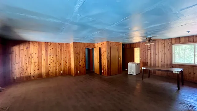 a view of storage and utility room with wooden floor