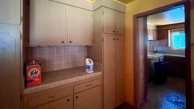 a view of an empty room with a fireplace