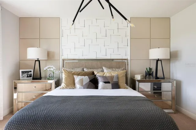 a bedroom with bed and a night stand