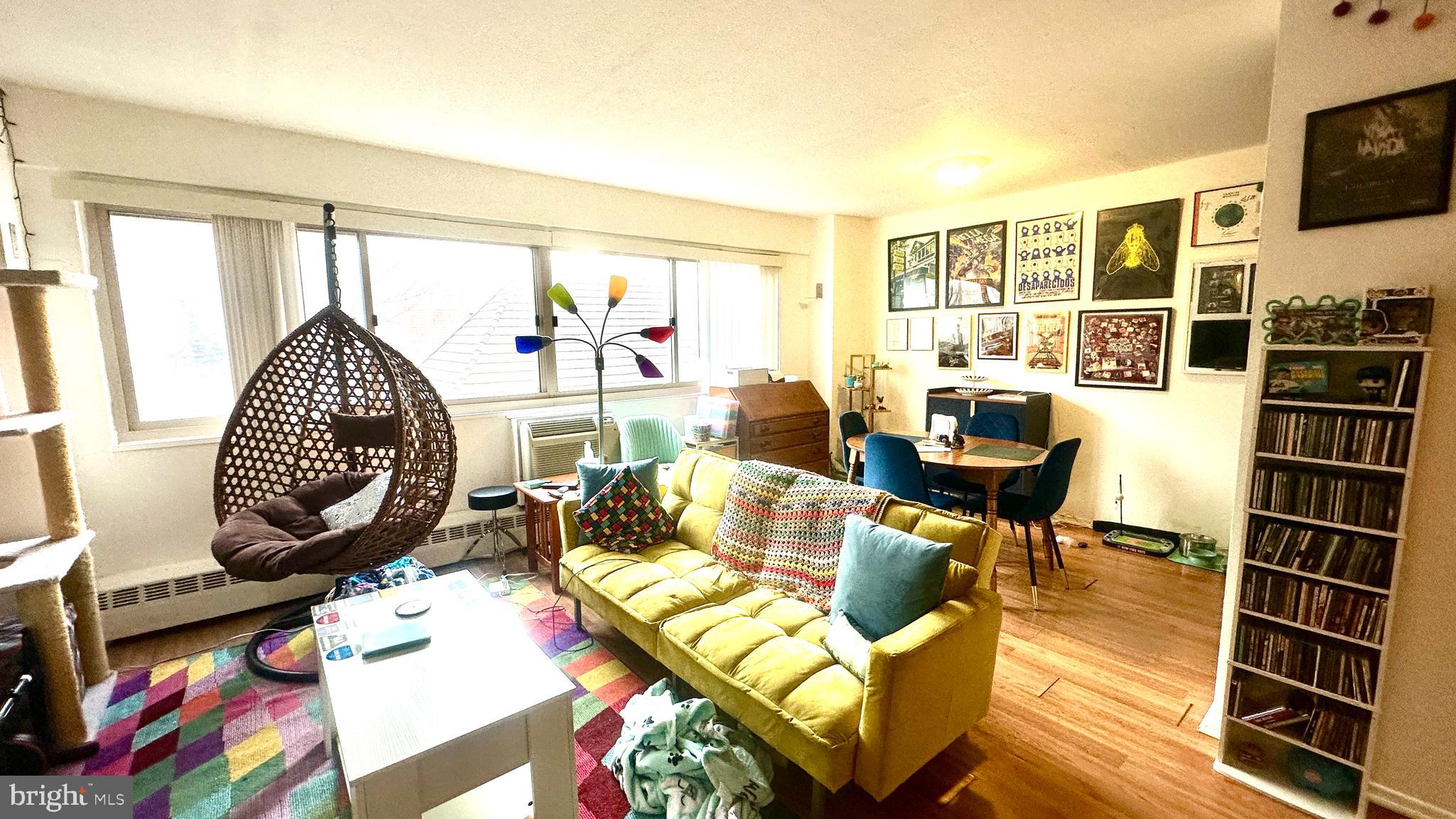 2101 Chestnut Street, Unit 317 Philadelphia, PA 19103 - Photo 23 of 39 a living room with furniture a rug and white walls