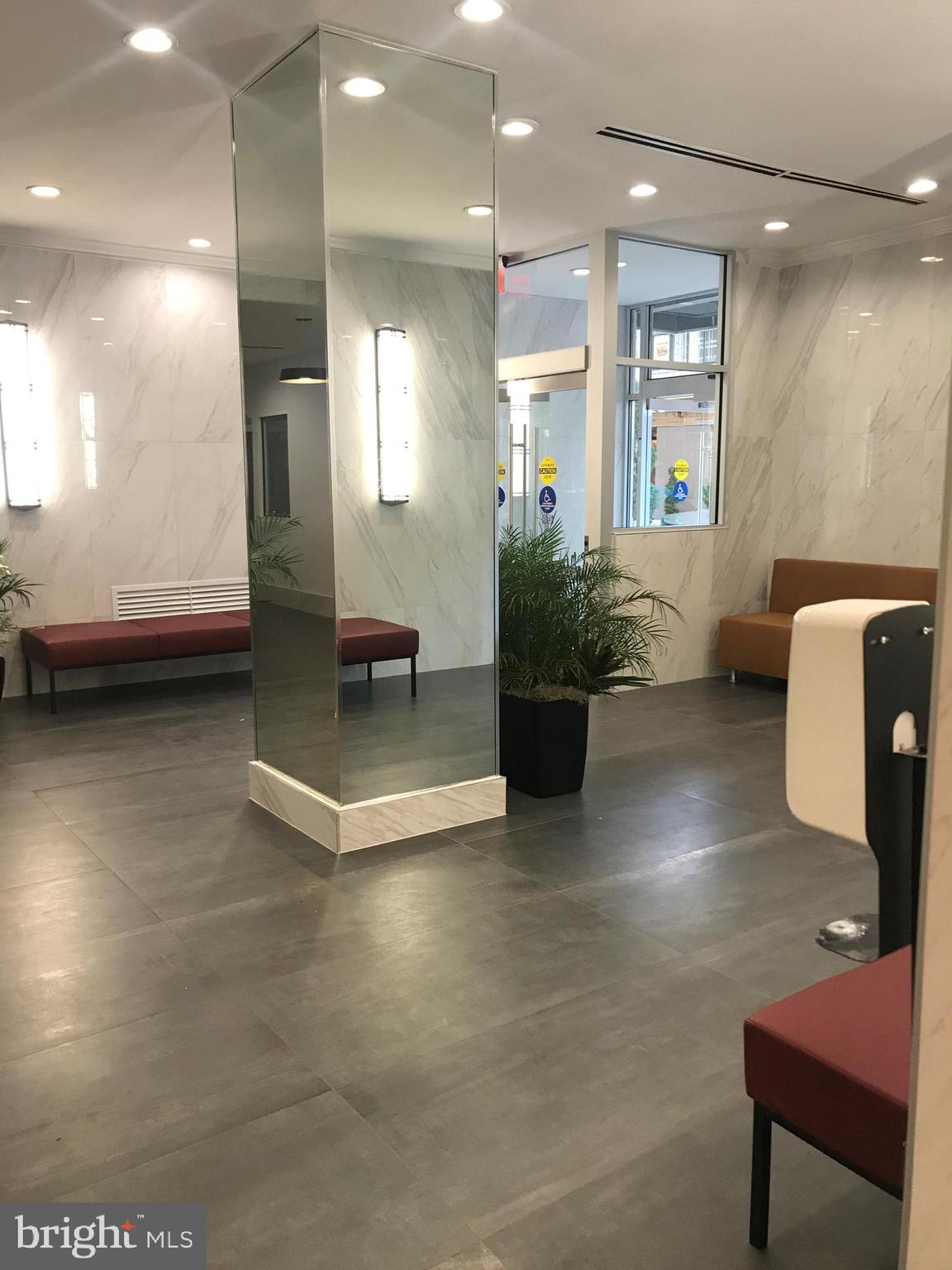 2101 Chestnut Street, Unit 317 Philadelphia, PA 19103 - Photo 6 of 39 a lobby with furniture and a potted plant