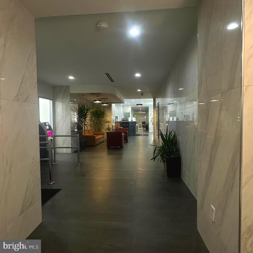 2101 Chestnut Street, Unit 317 Philadelphia, PA 19103 - Photo 7 of 39 a lobby with furniture and stairs