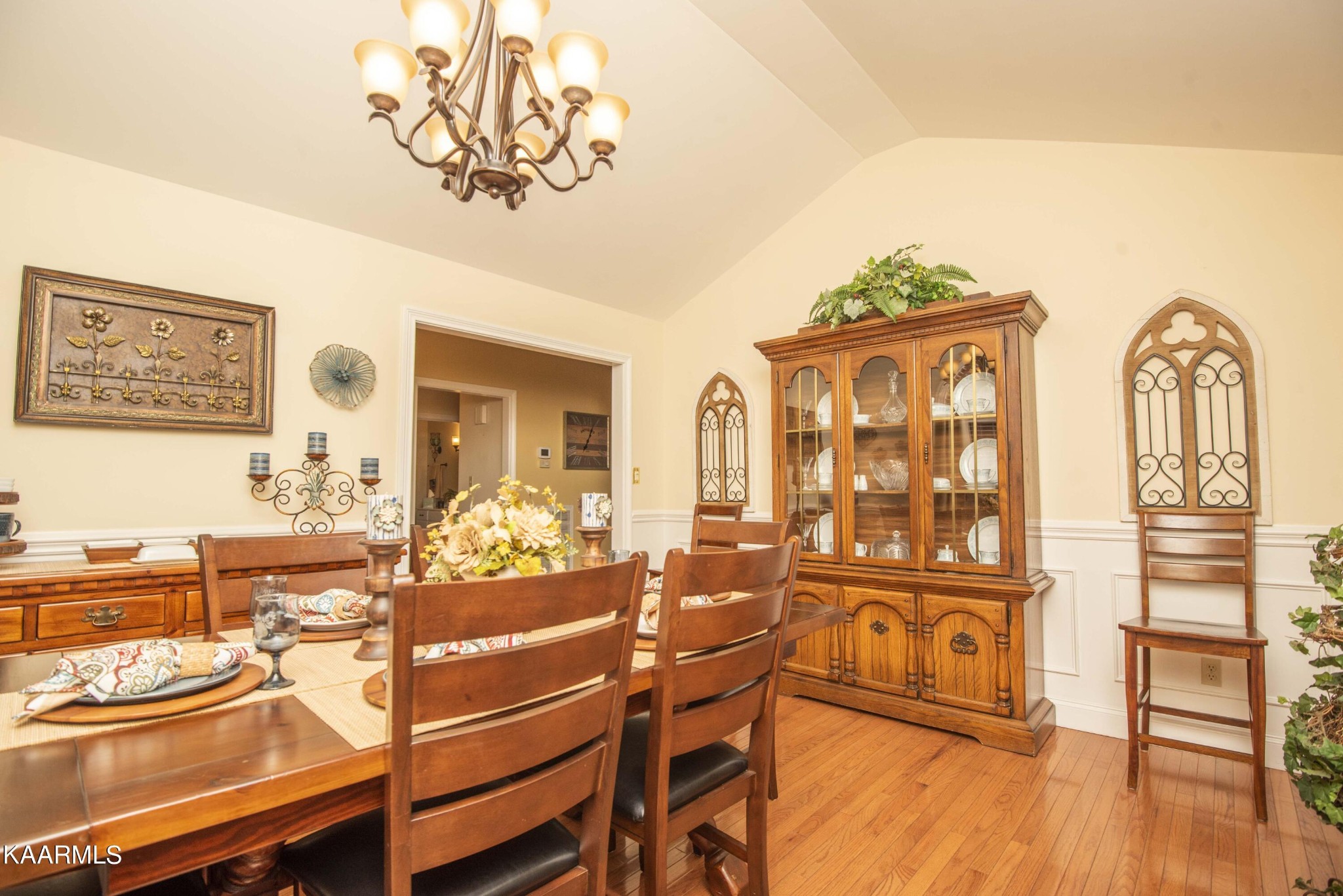 7412 Ridge Haven Court Corryton, TN 37721 - Photo 15 of 59 a view of a dining room with furniture a chandelier and wooden floor