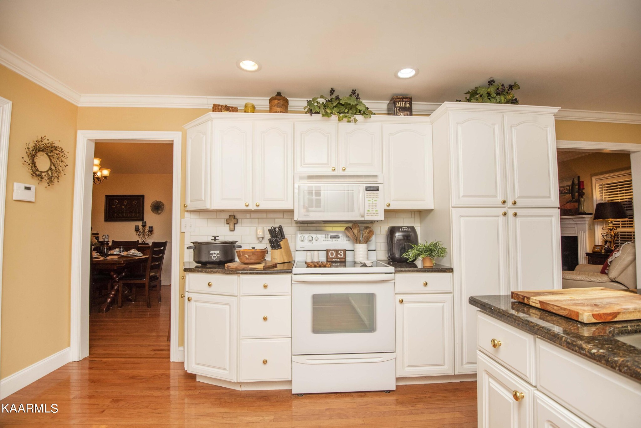 7412 Ridge Haven Court Corryton, TN 37721 - Photo 18 of 59 a kitchen with white cabinets and white appliances