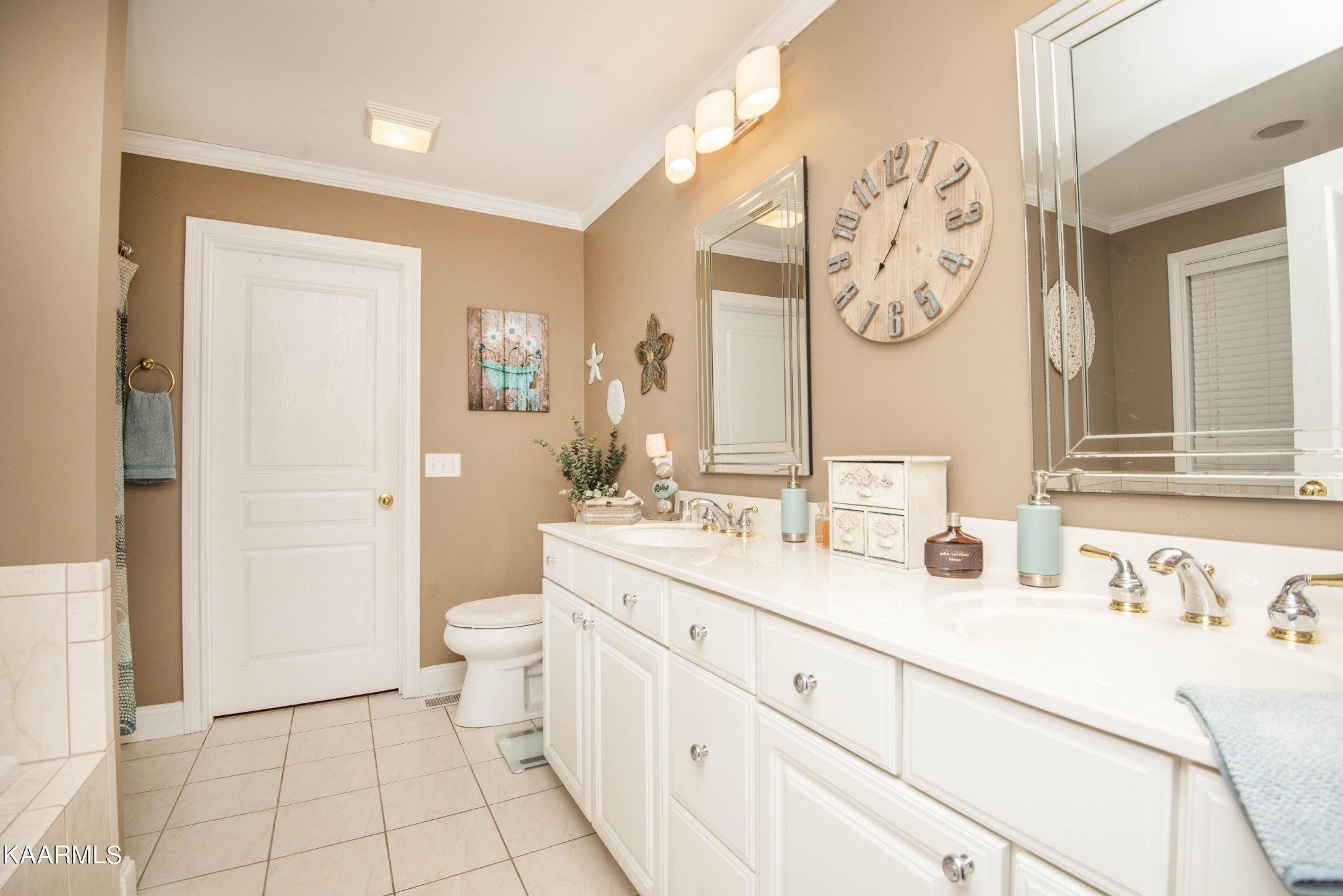 7412 Ridge Haven Court Corryton, TN 37721 - Photo 25 of 59 a bathroom with a double vanity sink mirror and toilet