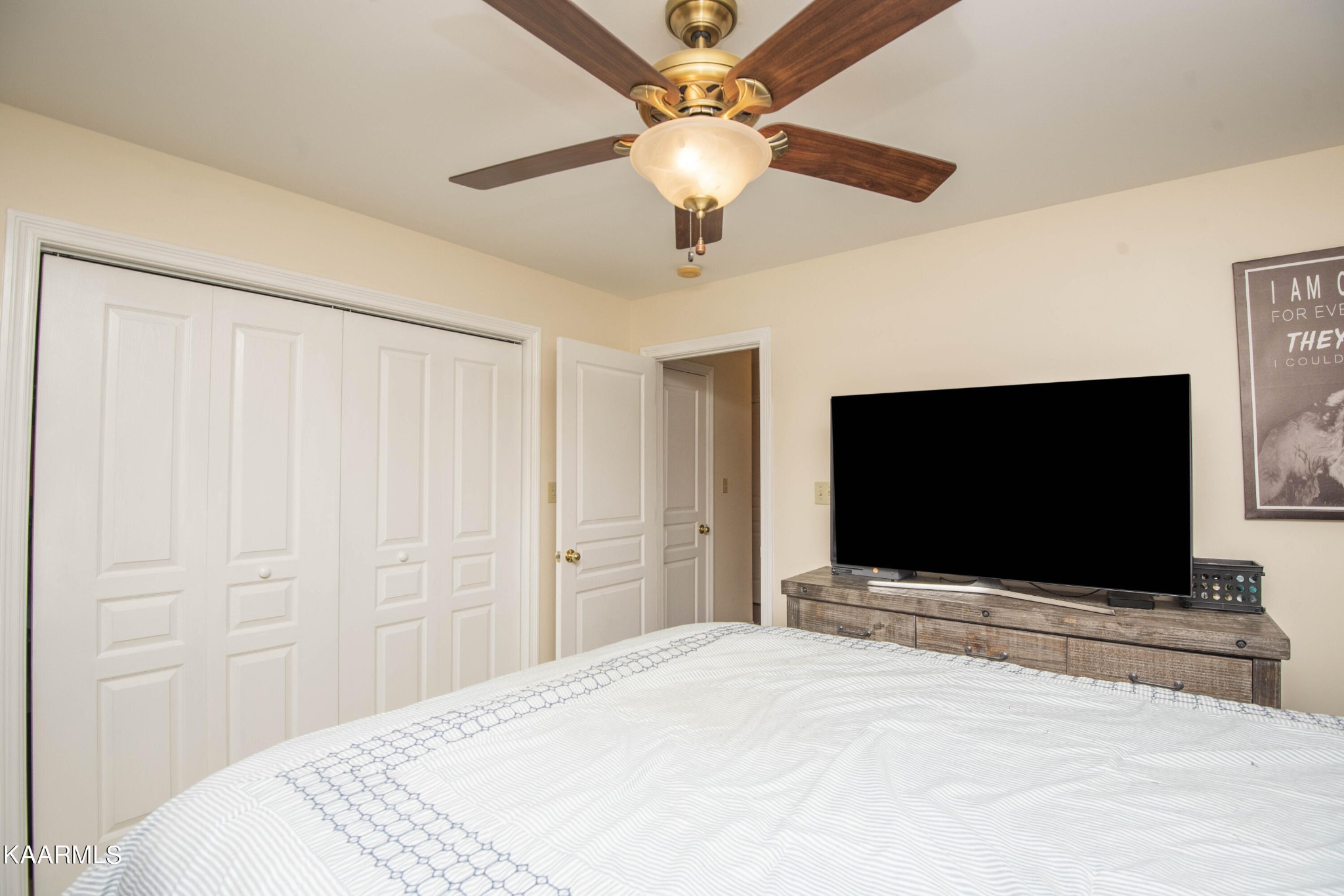 7412 Ridge Haven Court Corryton, TN 37721 - Photo 29 of 59 a bedroom with a bed and a flat screen tv