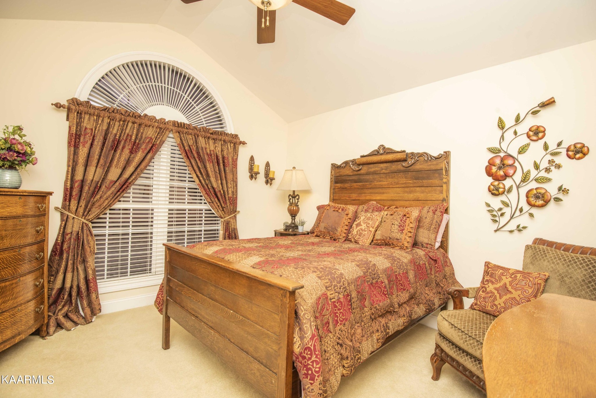 7412 Ridge Haven Court Corryton, TN 37721 - Photo 31 of 59 a bedroom with a bed and a chandelier
