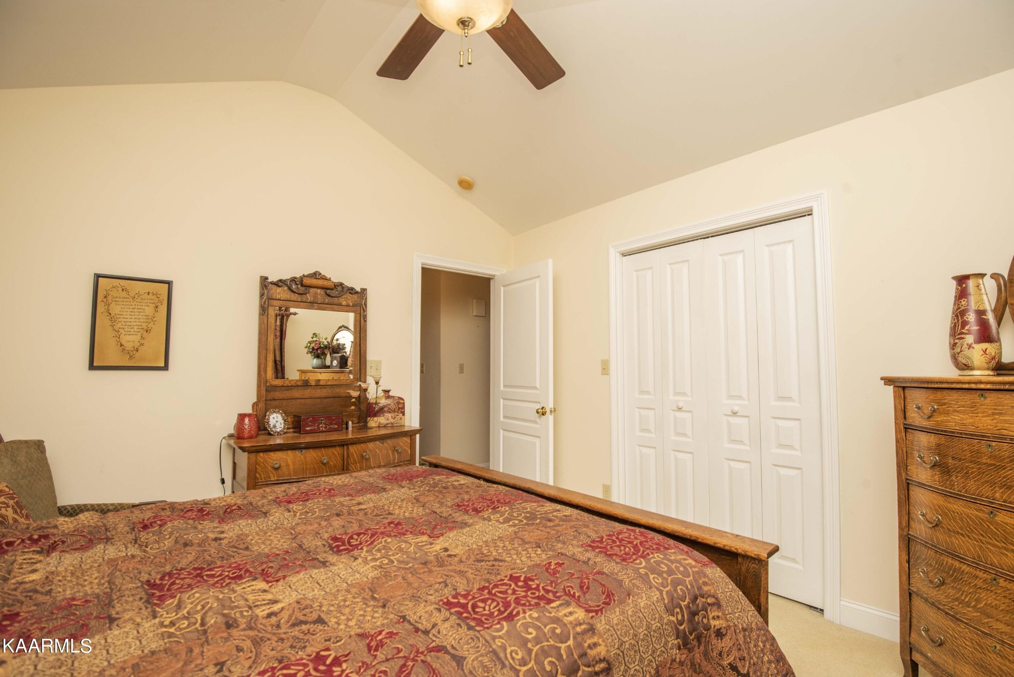 7412 Ridge Haven Court Corryton, TN 37721 - Photo 32 of 59 a bedroom with a bed and a chandelier