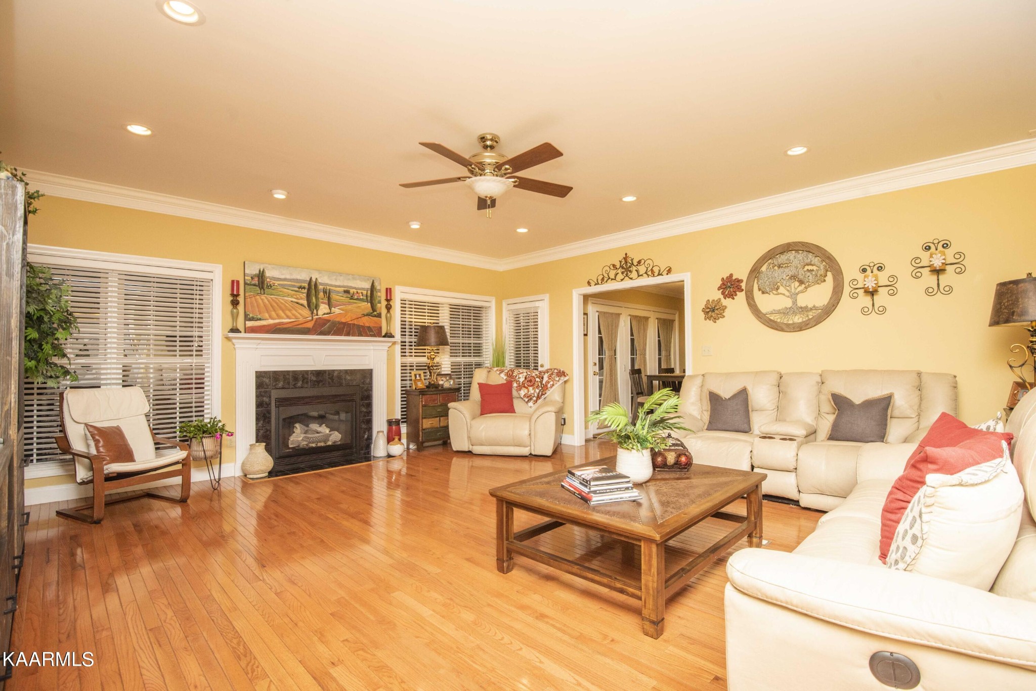7412 Ridge Haven Court Corryton, TN 37721 - Photo 9 of 59 a living room with furniture a fireplace and a table with wooden floor
