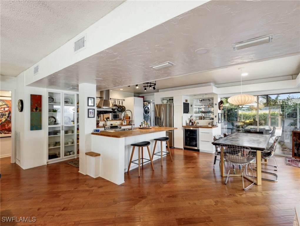 3666 Princeton Street Fort Myers, FL 33901 - Photo 13 of 31 a large kitchen with a table and chairs in it