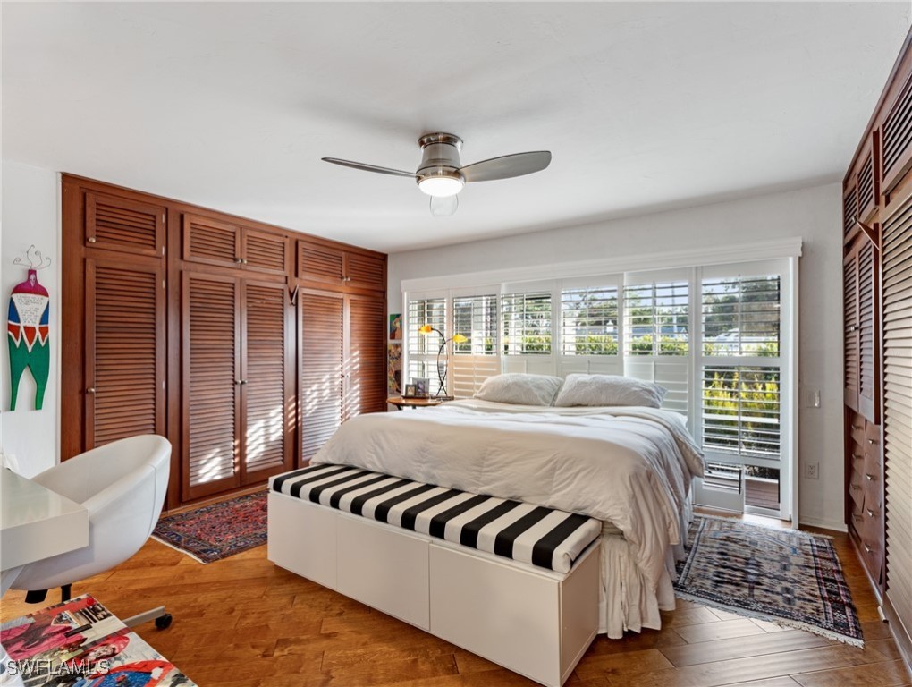 3666 Princeton Street Fort Myers, FL 33901 - Photo 20 of 31 a bedroom with a bed and wooden floor