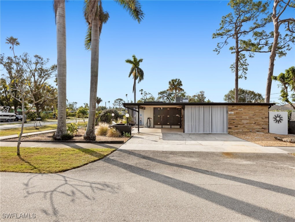 3666 Princeton Street Fort Myers, FL 33901 - Photo 3 of 31 a view of a terrace with a tree