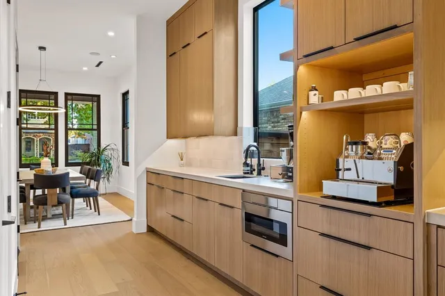 a kitchen with a sink cabinets and window