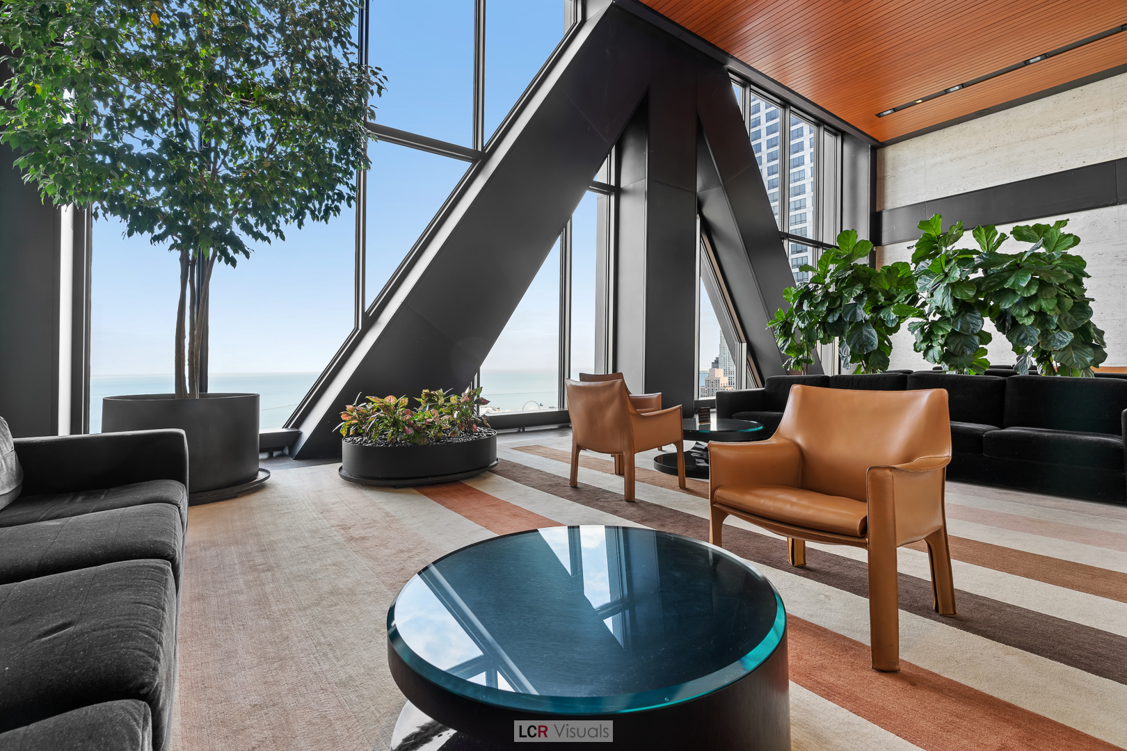 175 East Delaware Place, Unit 4816 Chicago, IL 60611 - Photo 20 of 30 a view of a couches in the patio with potted plants