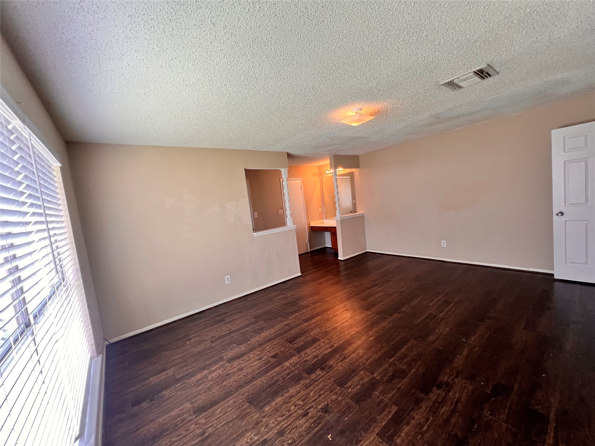 6331 Pouter Drive Houston, TX 77083 - Photo 22 of 28 a view of empty room with wooden floor and fan