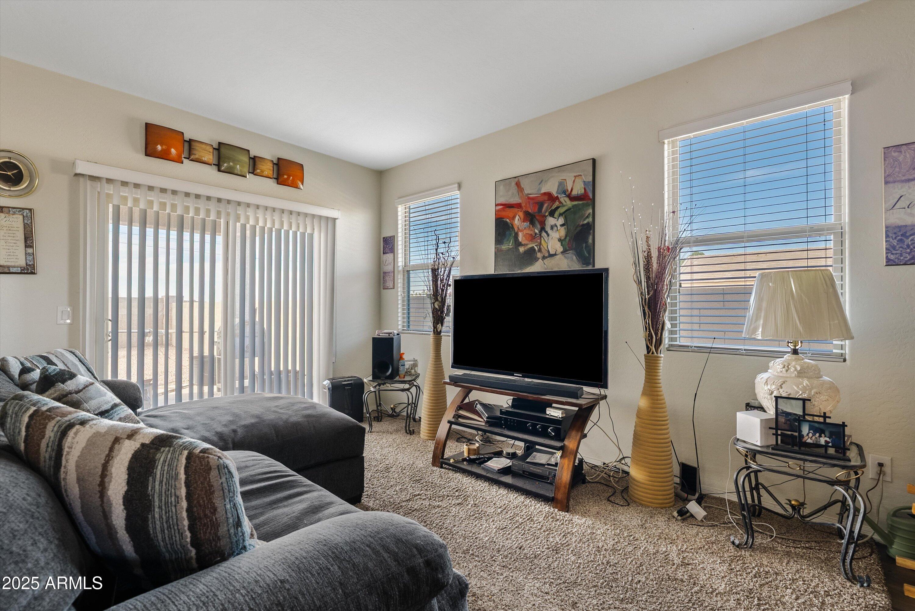 4708 South 26th Lane Phoenix, AZ 85041 - Photo 11 of 23 a living room with furniture and a flat screen tv