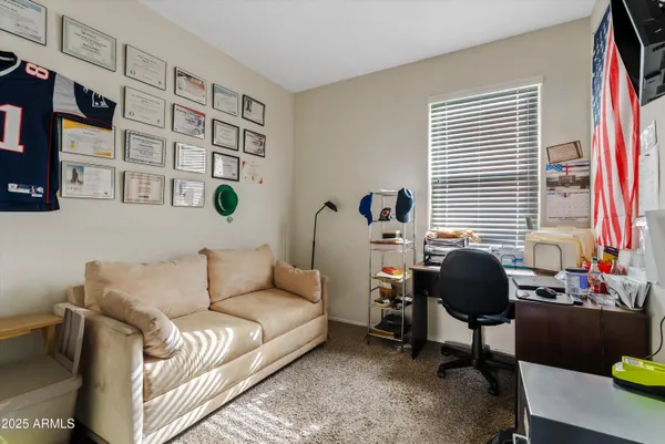 a living room with furniture and a window