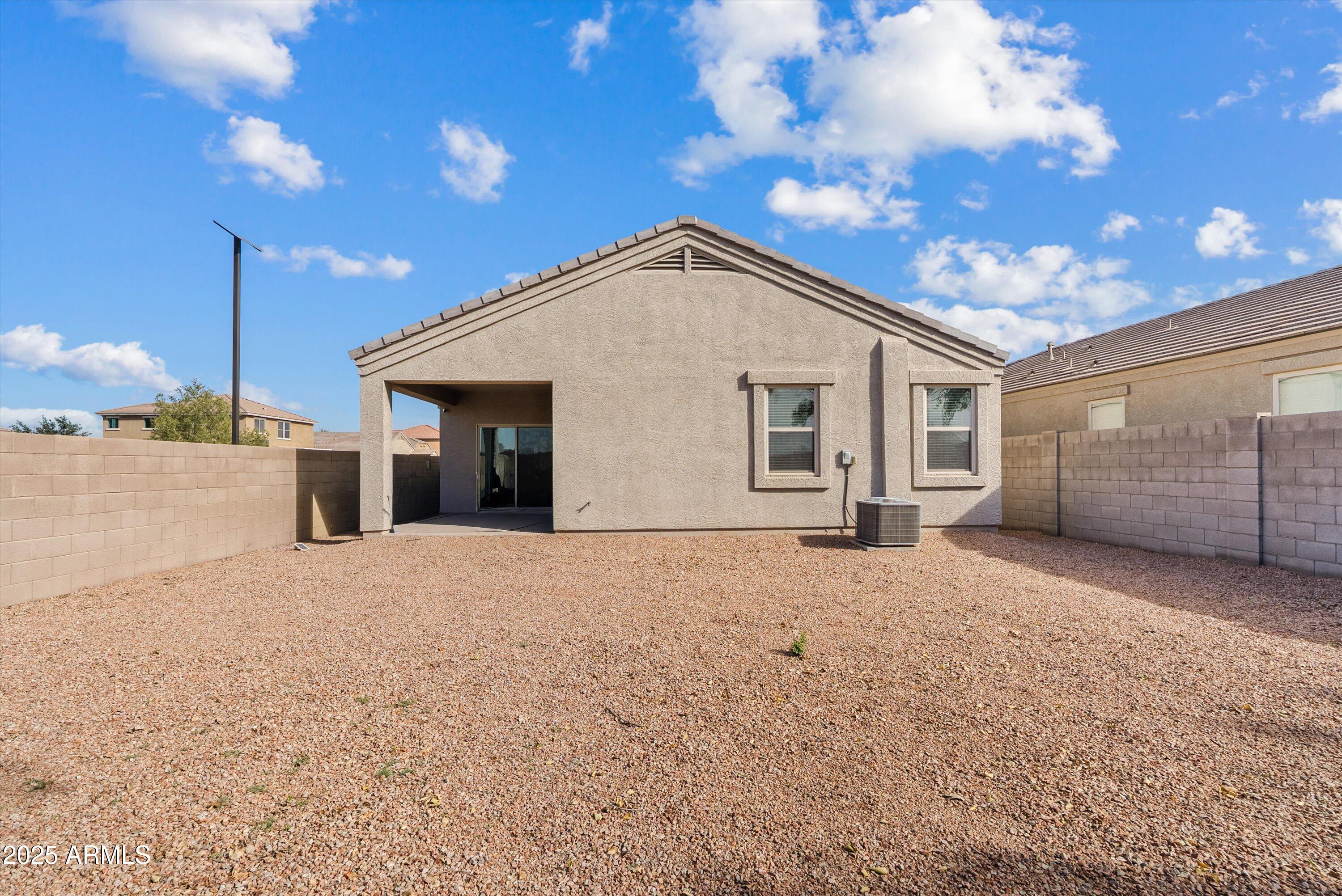 4708 South 26th Lane Phoenix, AZ 85041 - Photo 20 of 23 a view of a house with a yard and garage