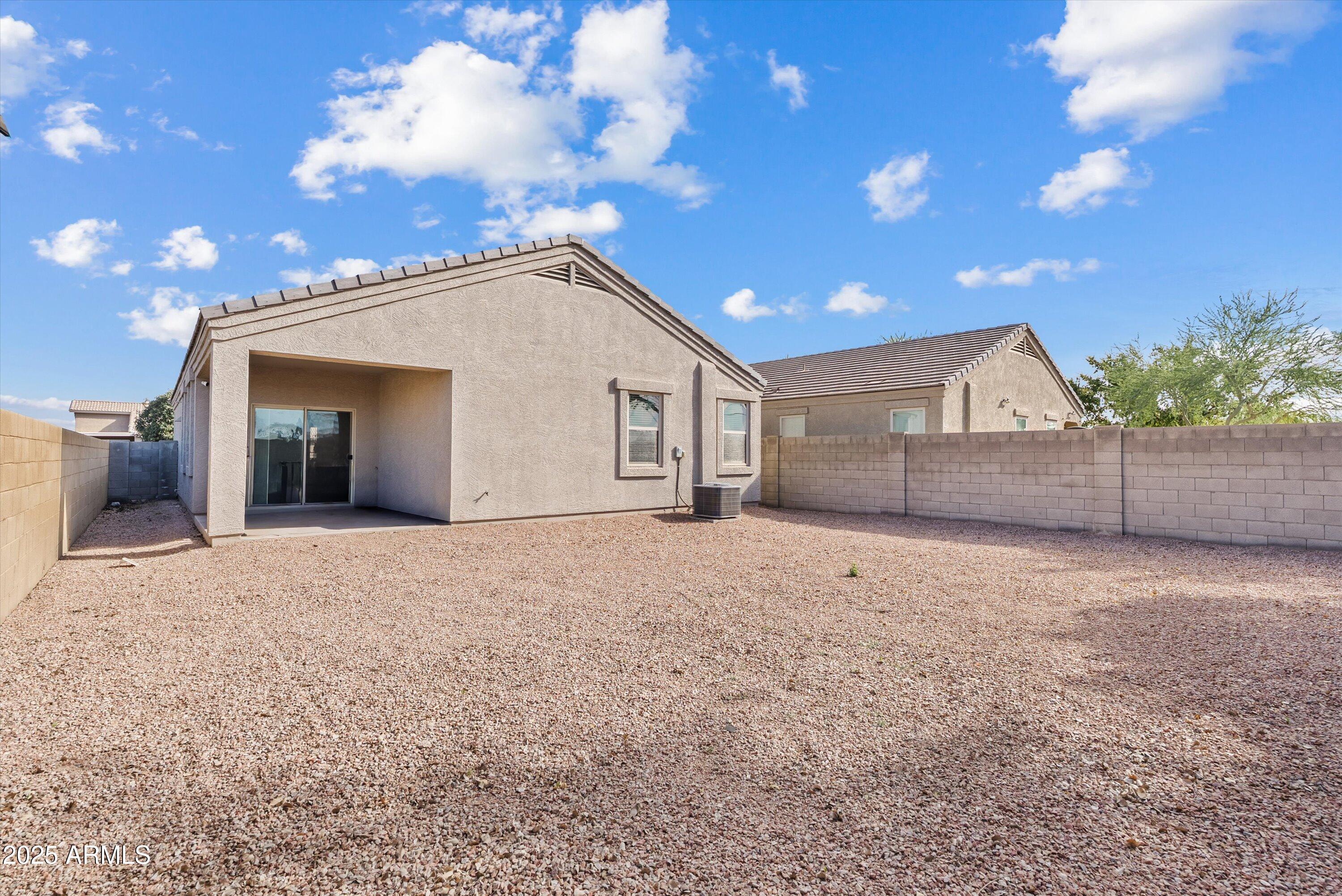 4708 South 26th Lane Phoenix, AZ 85041 - Photo 22 of 23 a view of a house with a yard and wooden fence