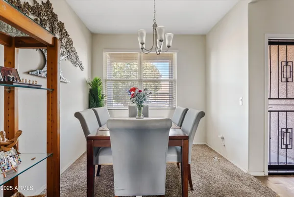 a view of a dining room with furniture window and outside view