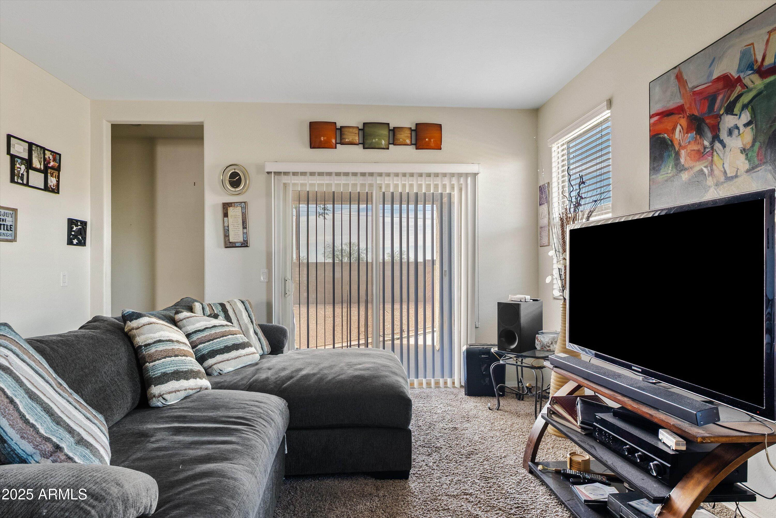 4708 South 26th Lane Phoenix, AZ 85041 - Photo 10 of 23 a living room with furniture and a flat screen tv