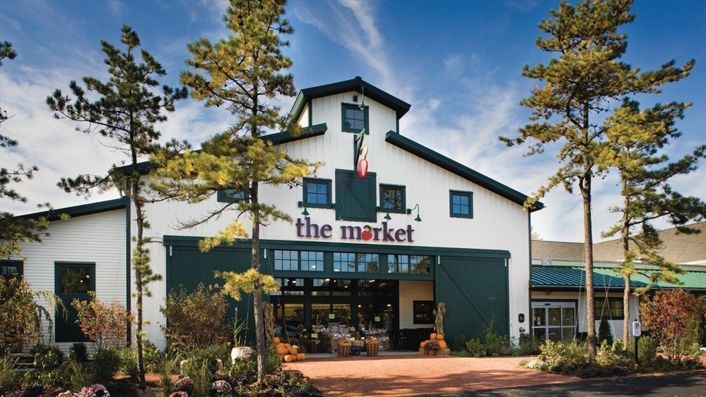 4 Broadleaf, Unit 15 Plymouth, MA 02360 - Photo 8 of 11 a front view of a house with garden