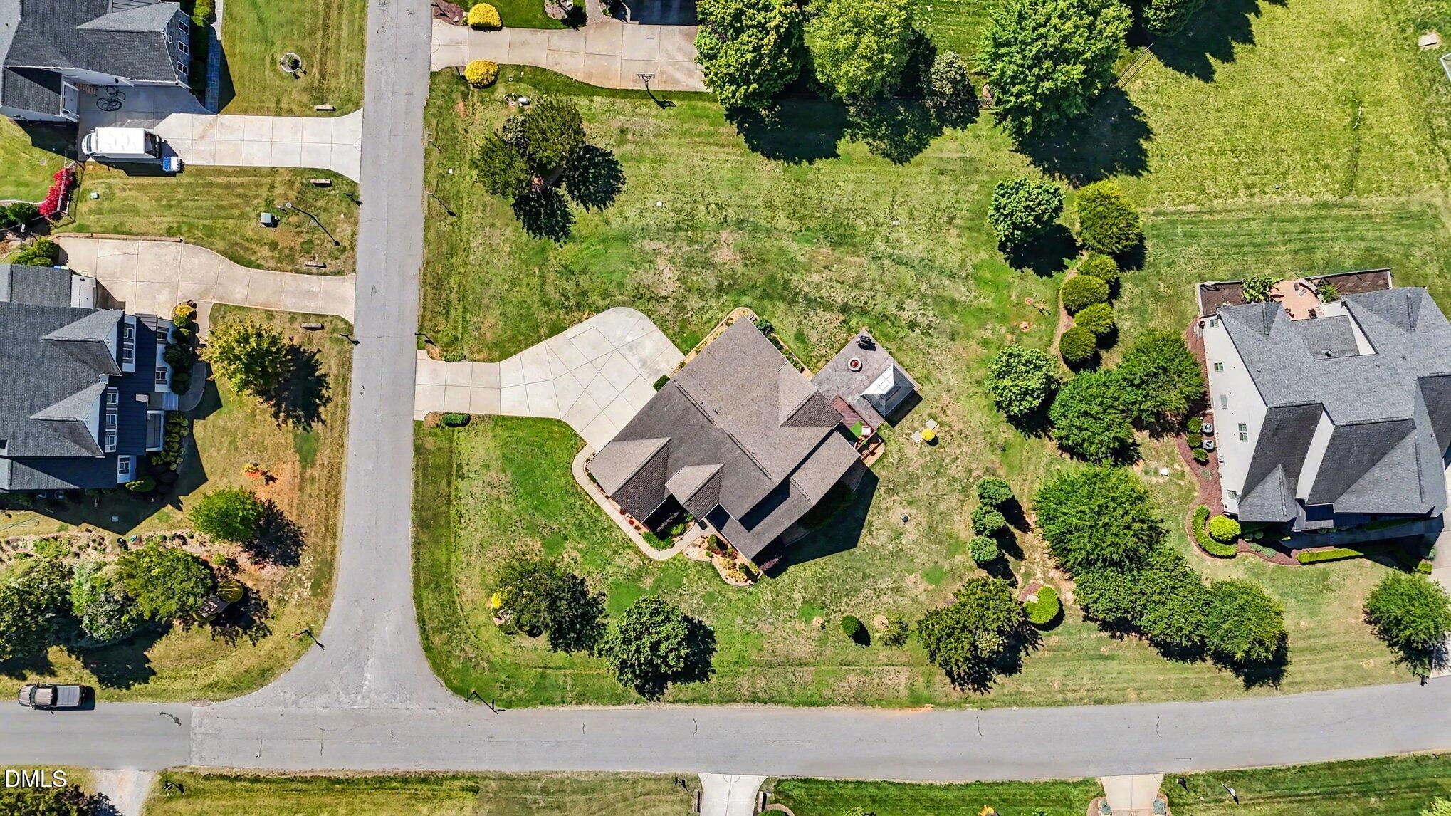 4000 Banks Stone Drive Raleigh, NC 27603 - Photo 55 of 60 an aerial view of a house with a yard and garden