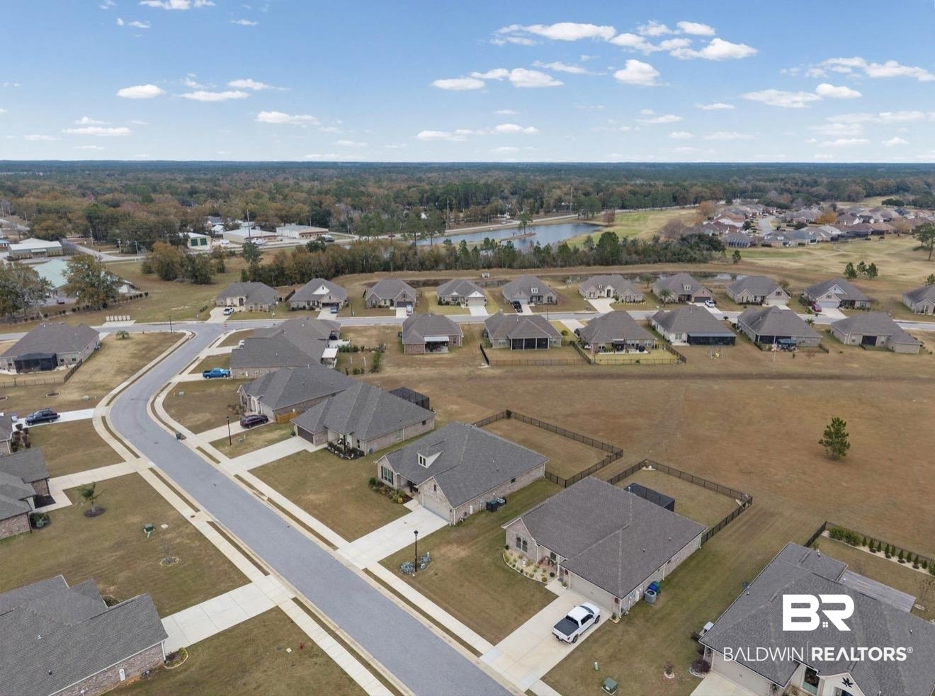10126 Chipper Lane Foley, AL 36535 - Photo 29 of 30 Aerial view of property and surrounding area featuring nearby suburban area and a nearby body of water