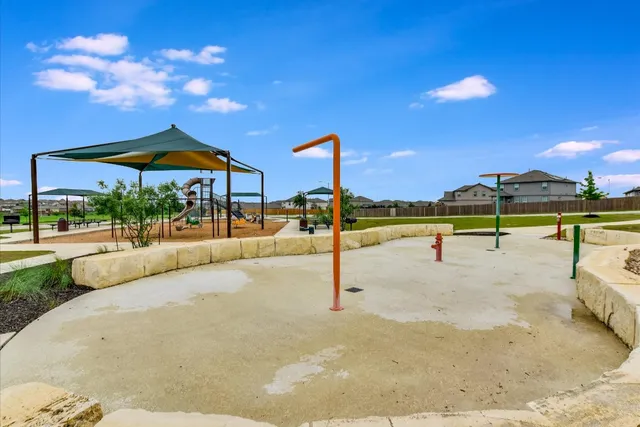 a view of a swimming pool with a lounge chairs