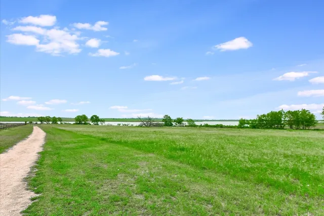a view of a lake with a big yard