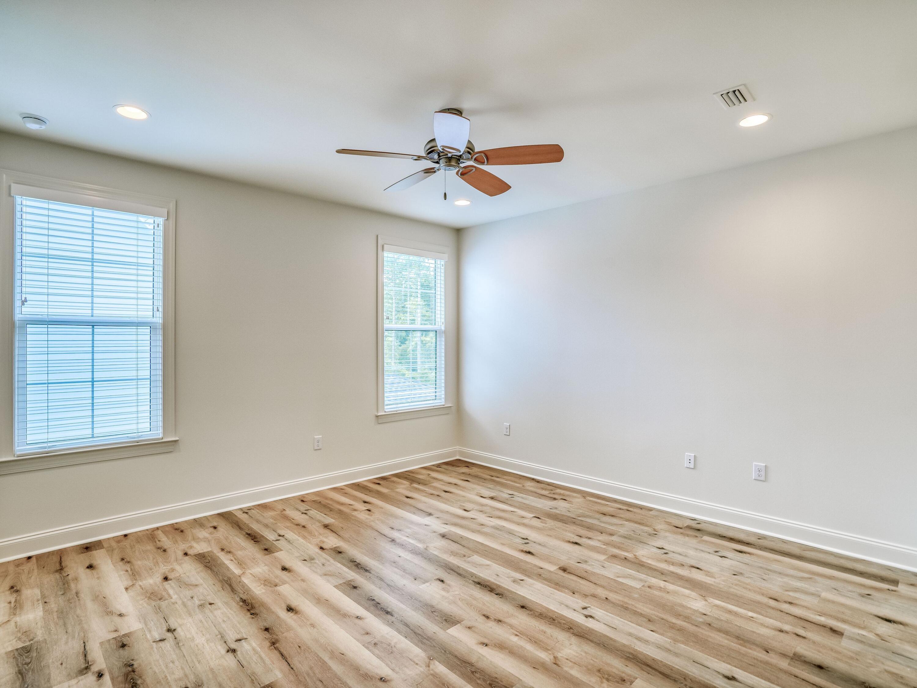 113 Conifer Court Watersound, FL 32461 - Photo 17 of 27 wooden floor in an empty room with a window