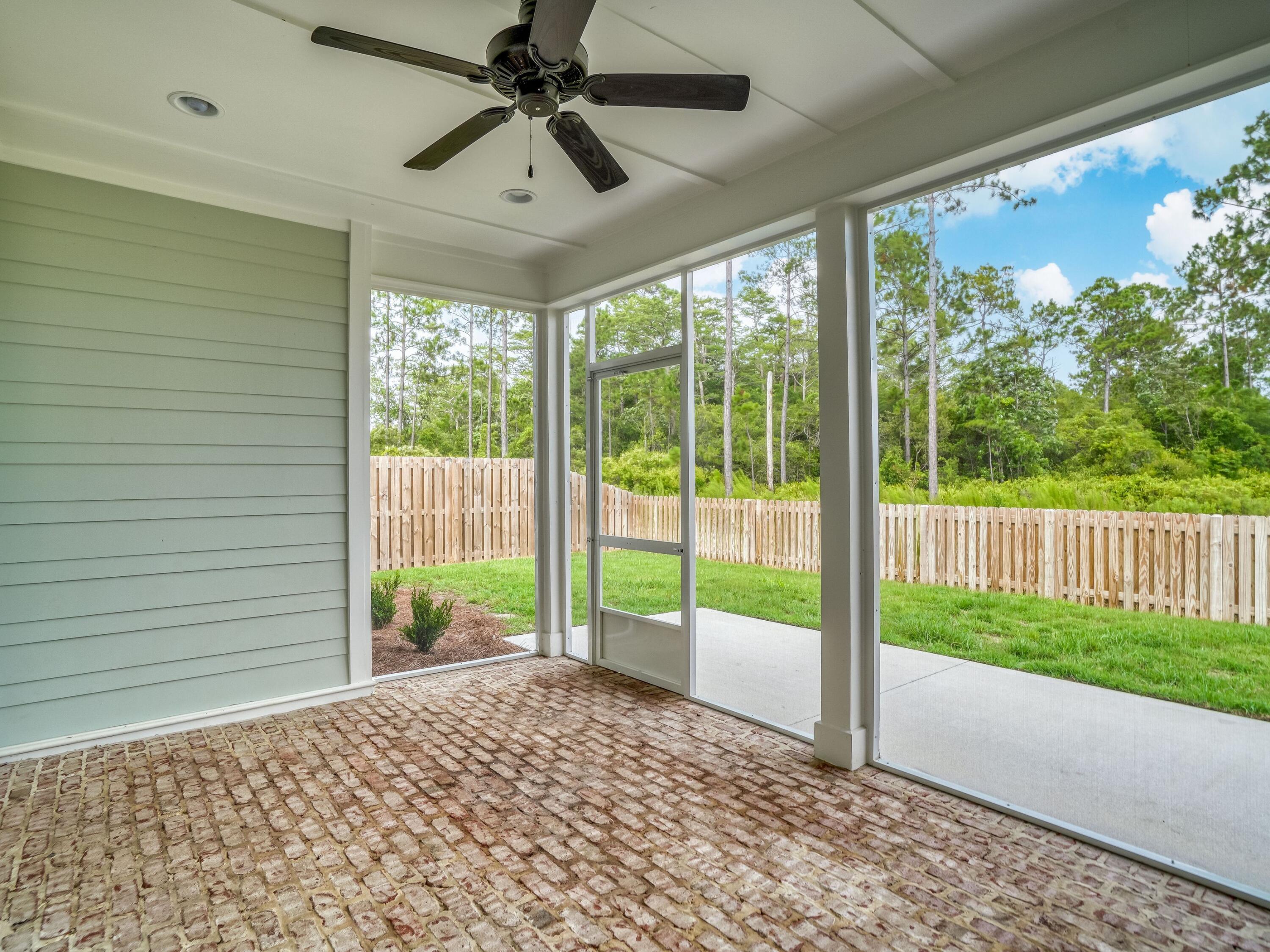 113 Conifer Court Watersound, FL 32461 - Photo 3 of 27 a view of a porch and garden
