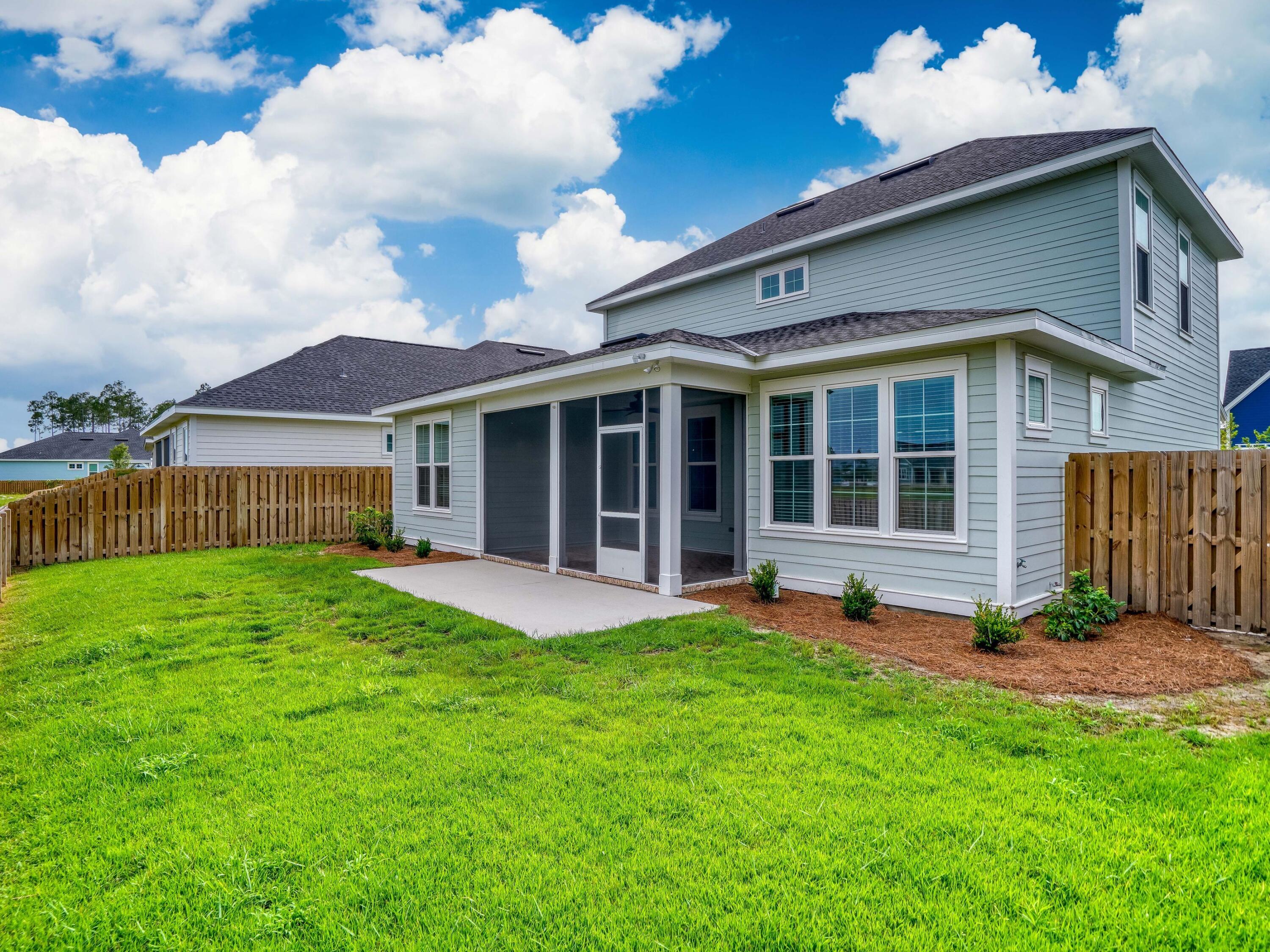 113 Conifer Court Watersound, FL 32461 - Photo 4 of 27 a view of a house with a garden