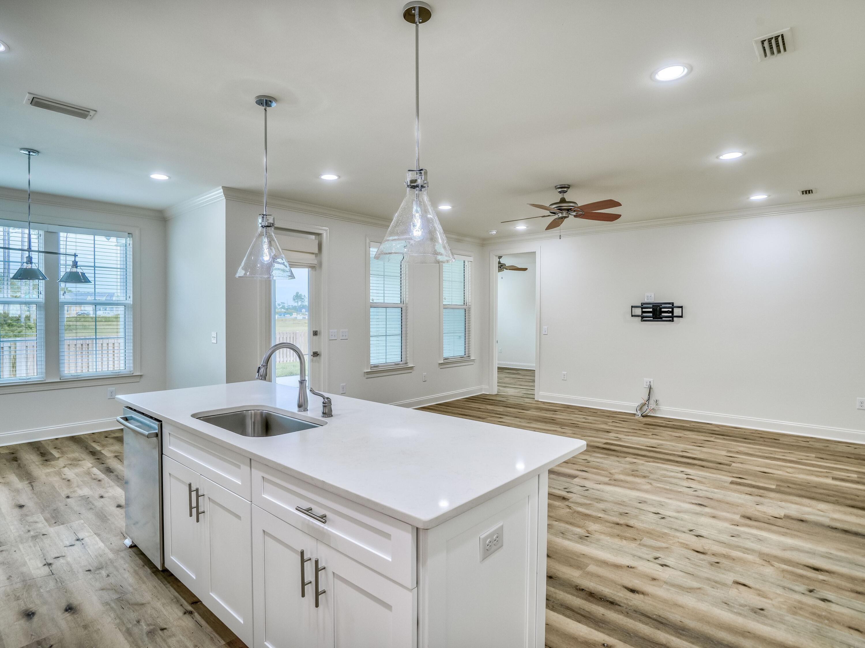 113 Conifer Court Watersound, FL 32461 - Photo 8 of 27 a kitchen with sink stove and refrigerator