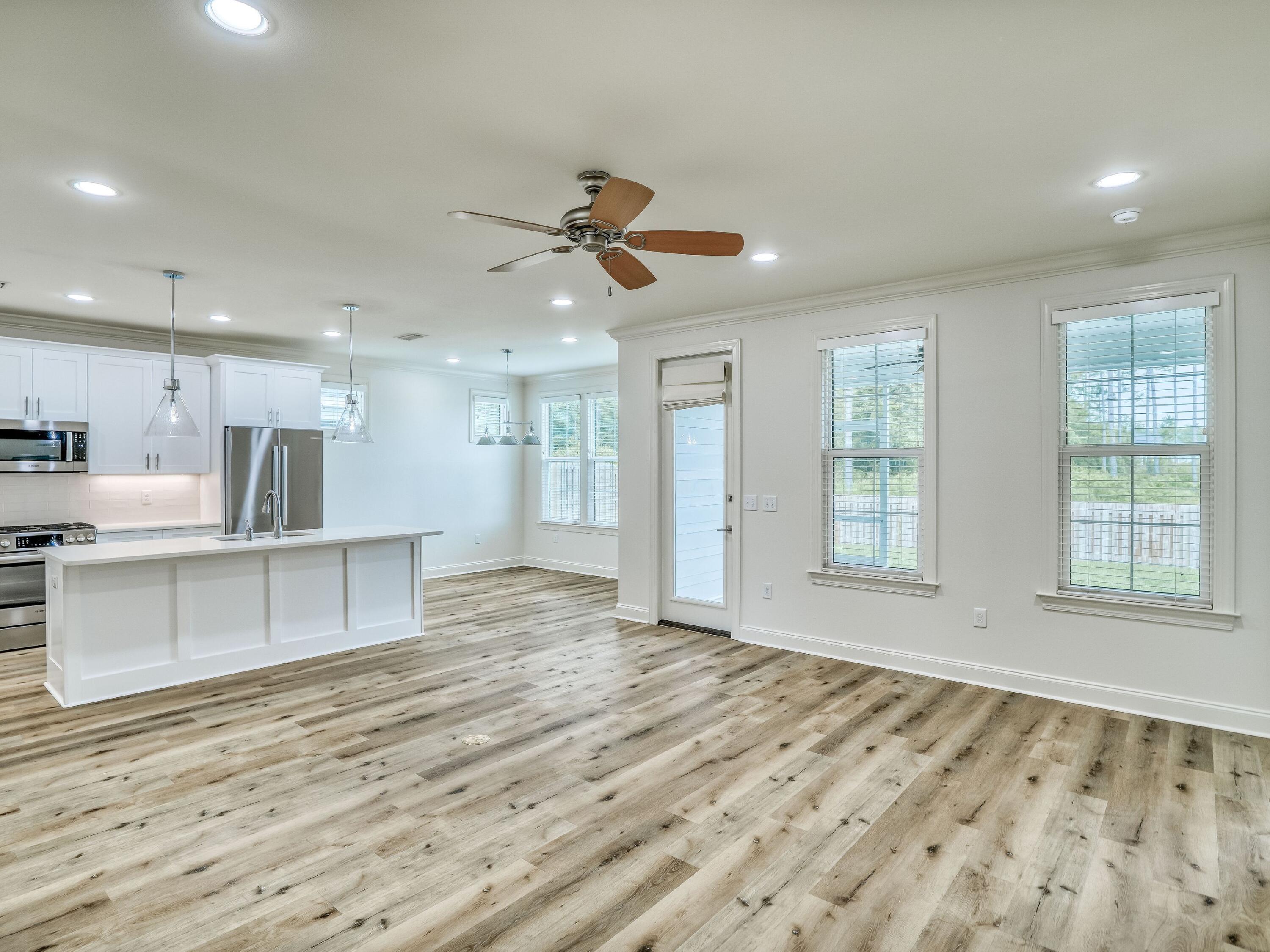 113 Conifer Court Watersound, FL 32461 - Photo 9 of 27 a view of an empty room with kitchen appliances and a window