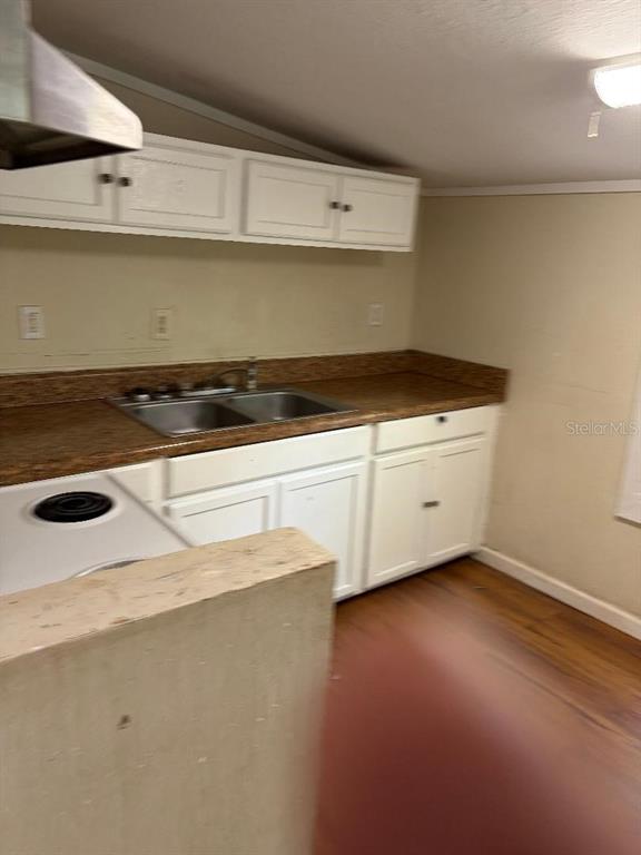 1623 Southeast 3rd Avenue Gainesville, FL 32641 - Photo 12 of 17 a close view of stove top oven sitting inside of a kitchen