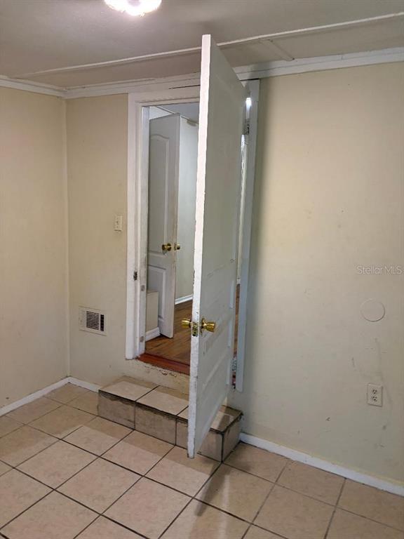 1623 Southeast 3rd Avenue Gainesville, FL 32641 - Photo 13 of 17 a bathroom with a sink and shower