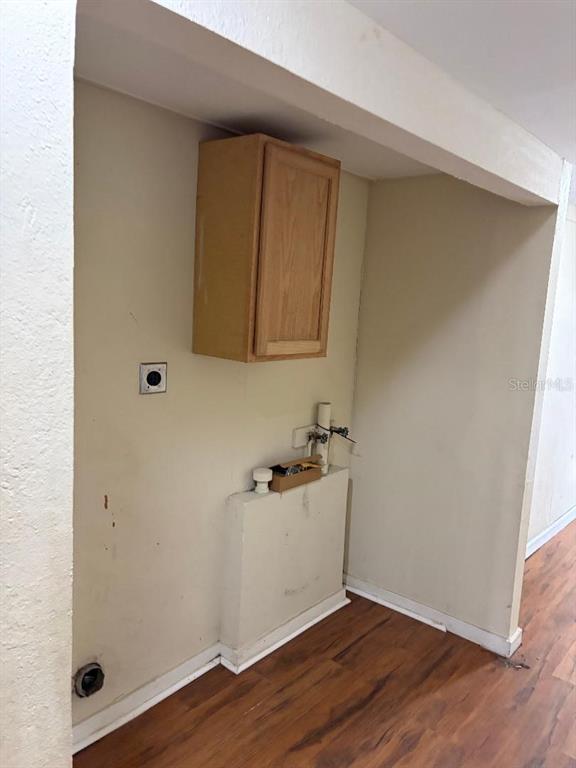 1623 Southeast 3rd Avenue Gainesville, FL 32641 - Photo 14 of 17 a view of an empty room with wooden floor and a window