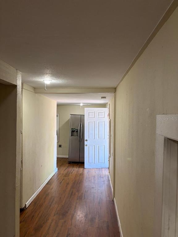 1623 Southeast 3rd Avenue Gainesville, FL 32641 - Photo 15 of 17 a view of hallway with bathroom and wooden floor
