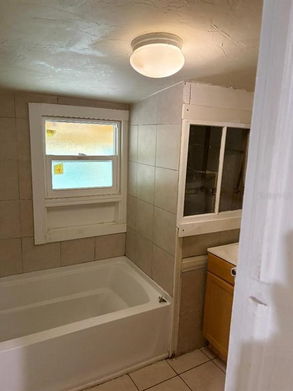 1623 Southeast 3rd Avenue Gainesville, FL 32641 - Photo 17 of 17 a bathroom with a bathtub and a shower