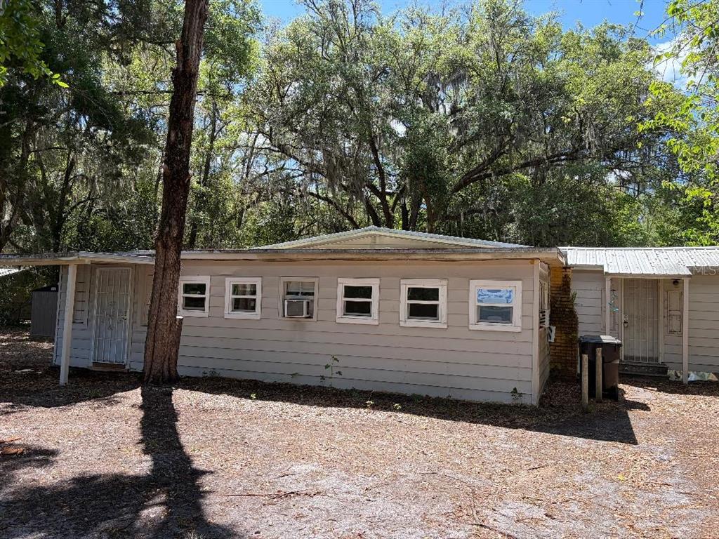 1623 Southeast 3rd Avenue Gainesville, FL 32641 - Photo 3 of 17 a front view of a house with a yard