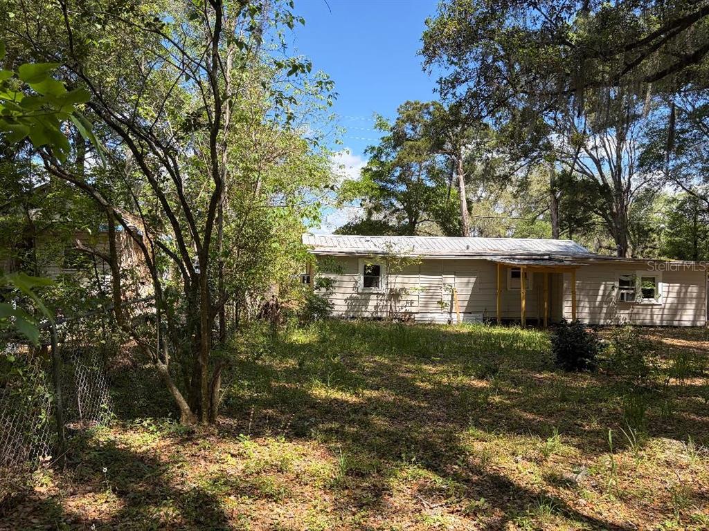 1623 Southeast 3rd Avenue Gainesville, FL 32641 - Photo 7 of 17 a view of a house with a yard