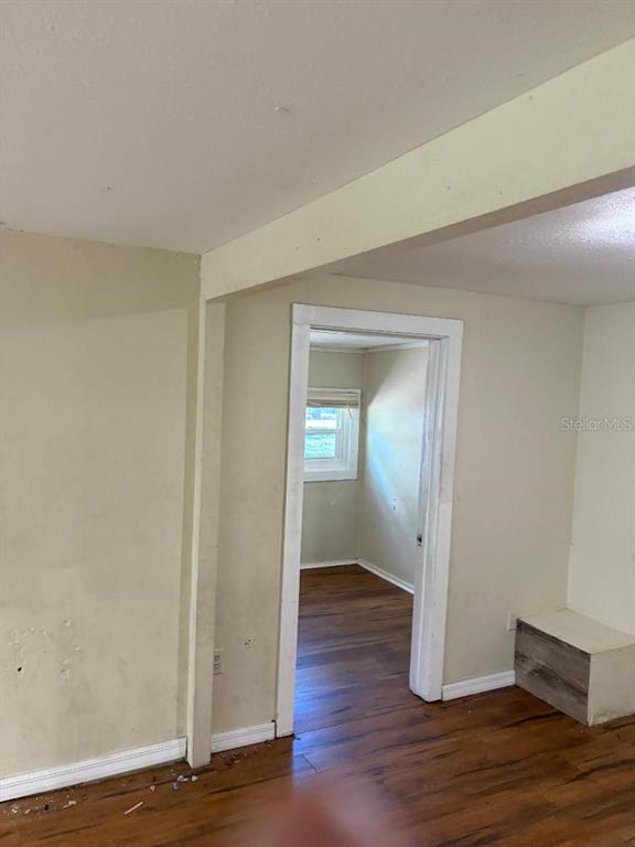 1623 Southeast 3rd Avenue Gainesville, FL 32641 - Photo 10 of 17 a view of an empty room with wooden floor