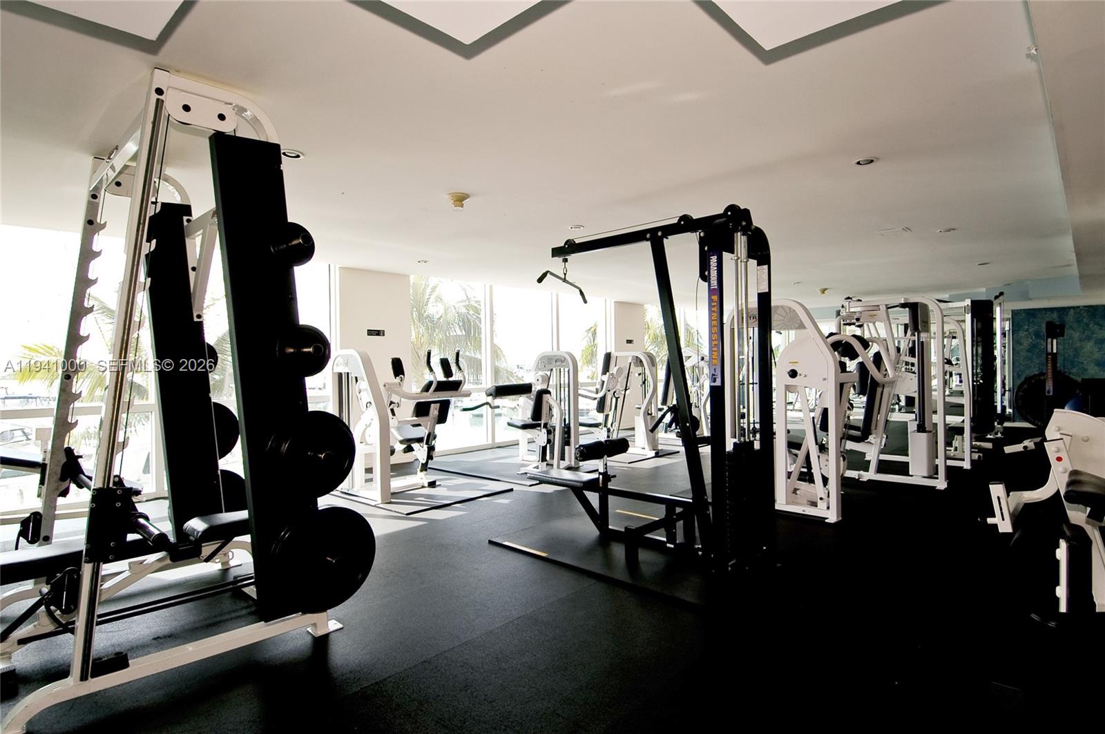 90 Alton Road, Unit 2803 Miami Beach, FL 33139 - Photo 16 of 21 a view of a room with gym equipment