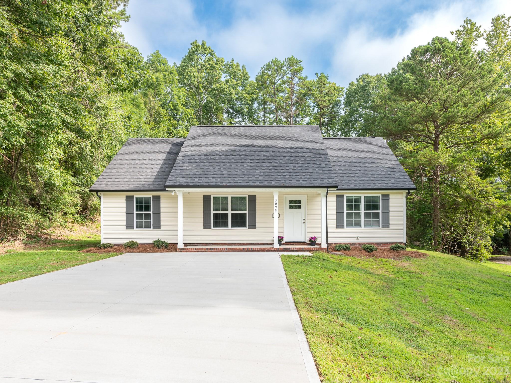front view of a house with a yard