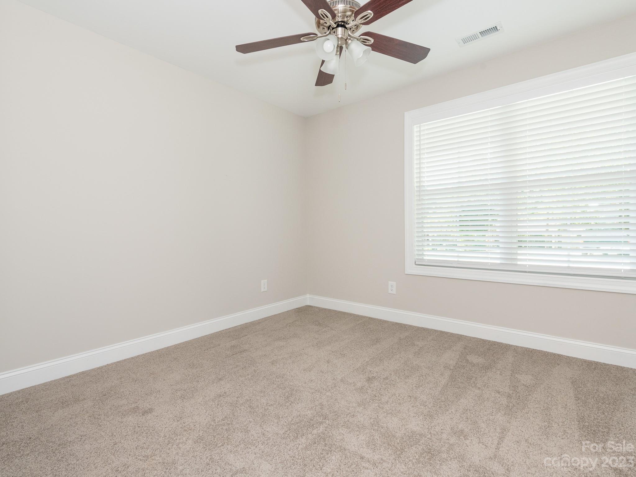 3095 Simmons Street Kannapolis, NC 28083 - Photo 16 of 21 an empty room with a window and a fan