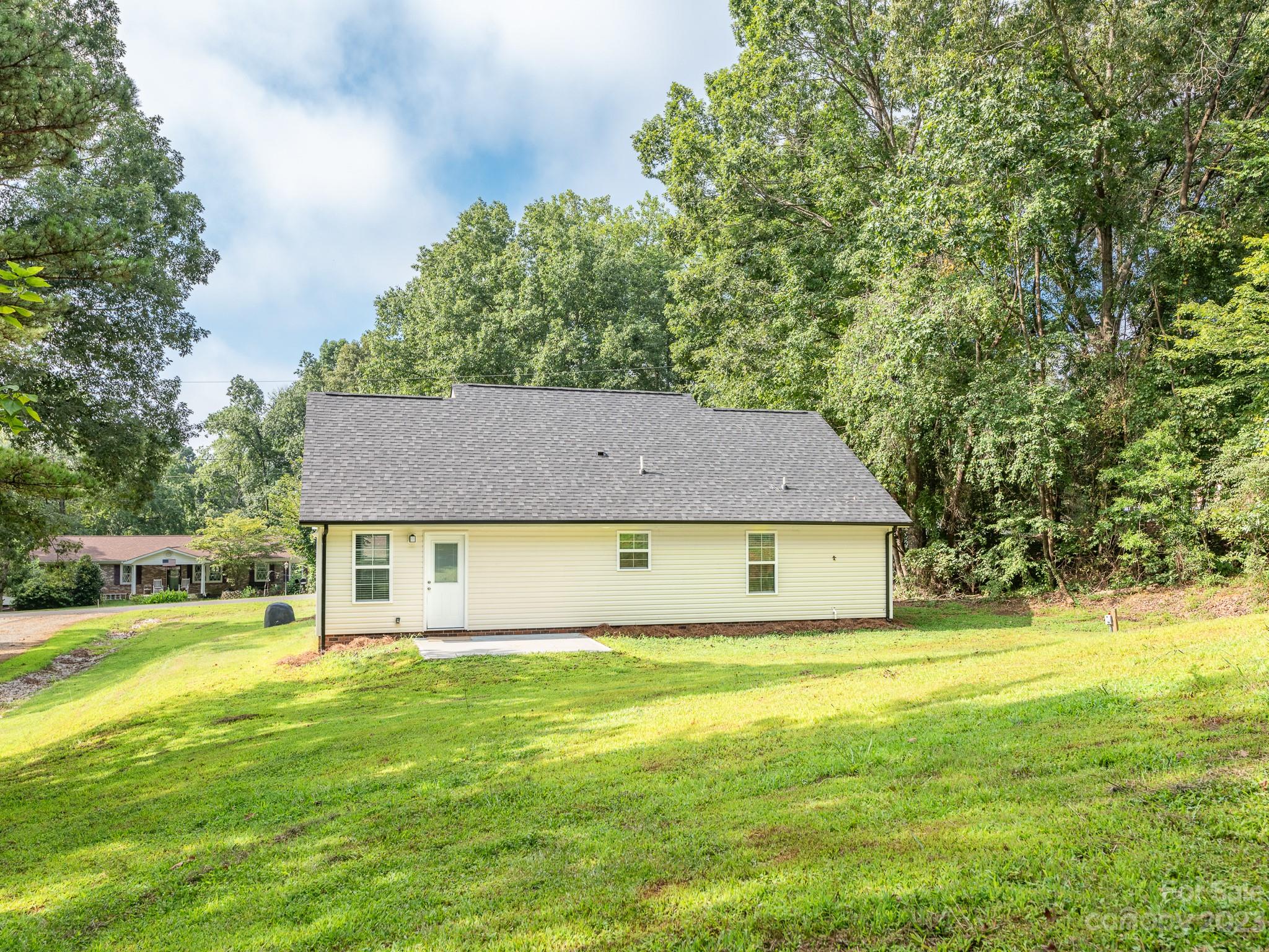 3095 Simmons Street Kannapolis, NC 28083 - Photo 19 of 21 a house view with swimming pool in front of it
