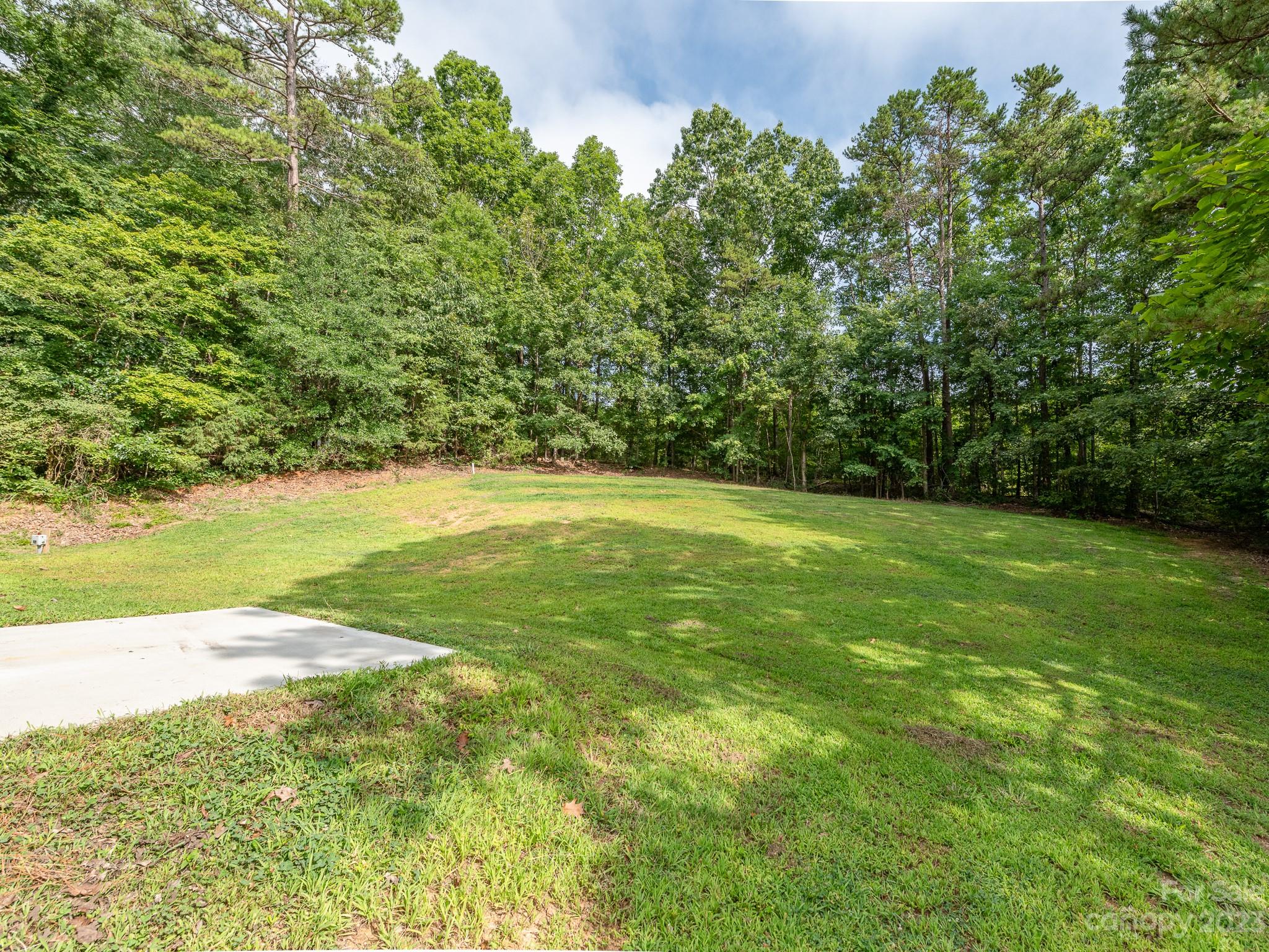 3095 Simmons Street Kannapolis, NC 28083 - Photo 2 of 21 a view of a field with an trees