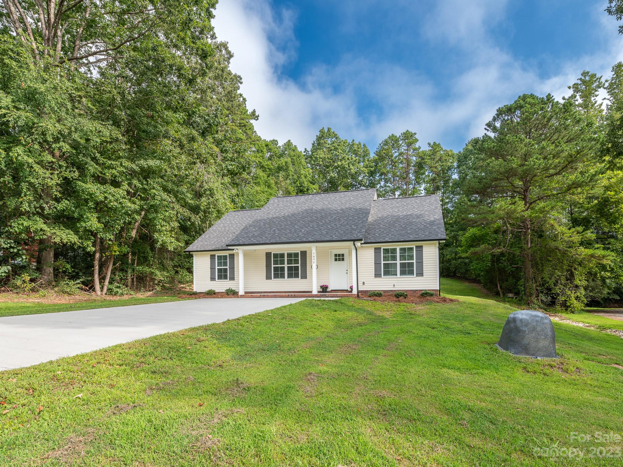 3095 Simmons Street Kannapolis, NC 28083 - Photo 21 of 21 a front view of a house with a yard