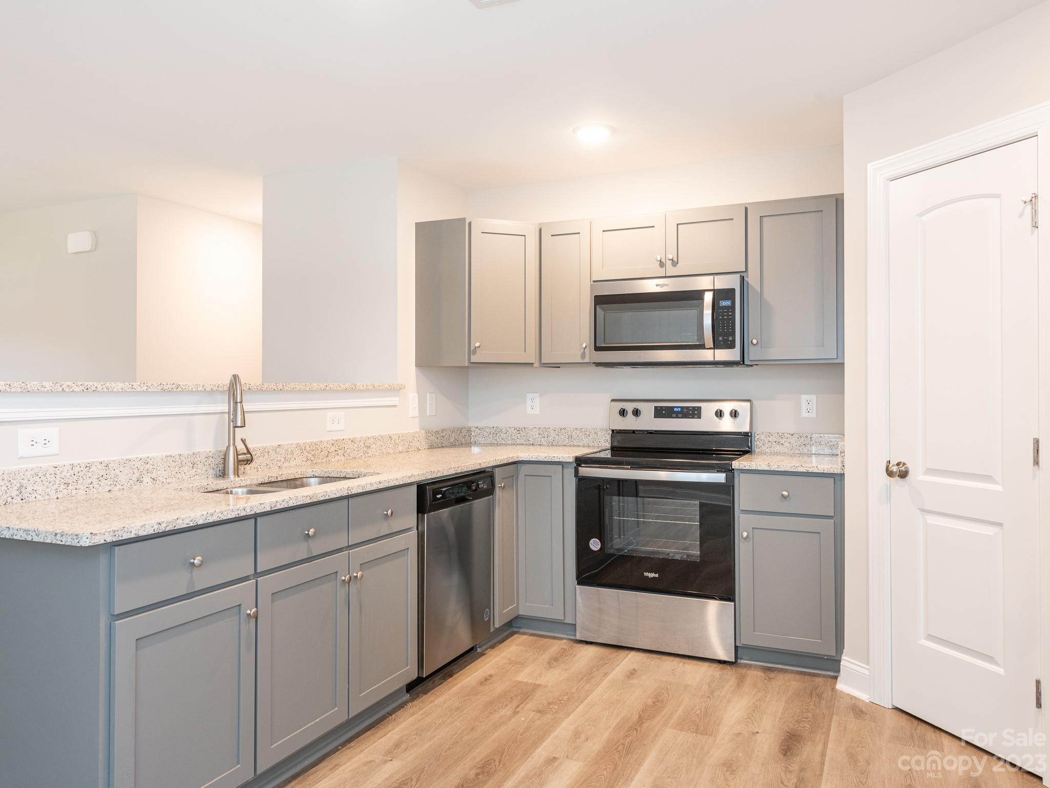 3095 Simmons Street Kannapolis, NC 28083 - Photo 7 of 21 a kitchen with a sink stove and microwave